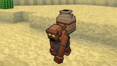 A Dust Hollow on desert sand, bent double under an empty clay urn, its amber eyes lit.