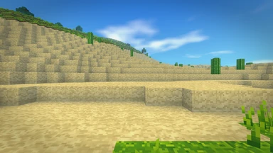 A desert valley under a blue sky with nothing over it: no hotbar, no compass, no crosshair.